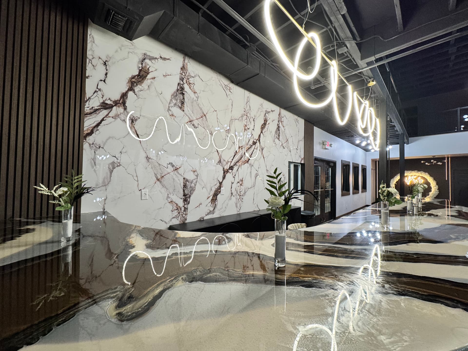 Marble wall and balcony lights at Altar'd Event Venue